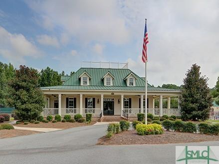 view of front of house with a standing seam roof, covered porch, and metal roof