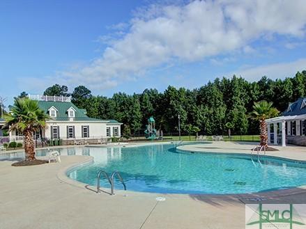 community pool with a patio area