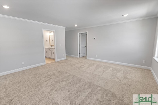 unfurnished bedroom featuring recessed lighting, ornamental molding, light carpet, connected bathroom, and baseboards