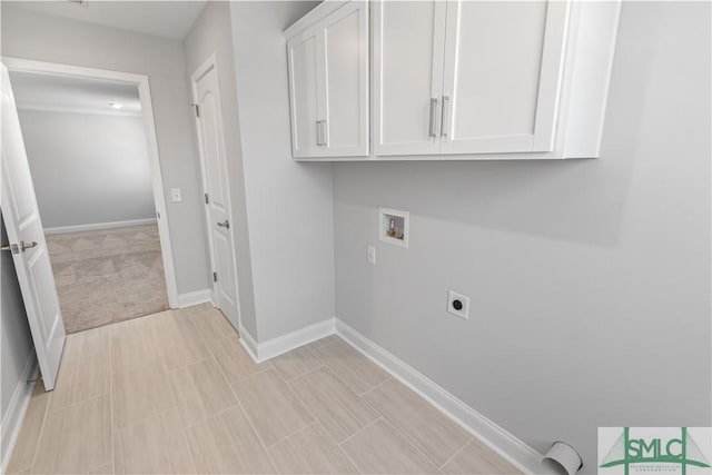 laundry area with cabinet space, baseboards, washer hookup, and hookup for an electric dryer