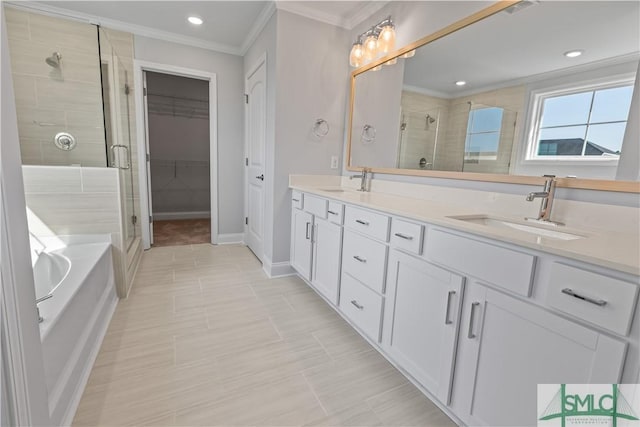 bathroom with ornamental molding, a stall shower, a sink, and double vanity