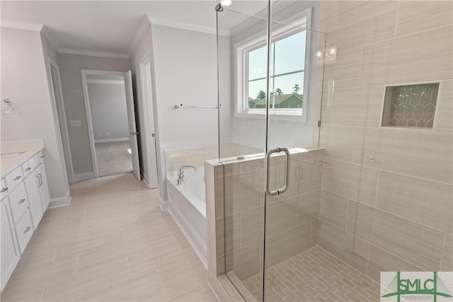 bathroom featuring crown molding, vanity, a shower stall, baseboards, and a bath