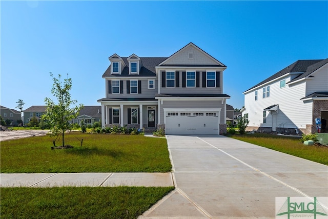 view of front of home with a front lawn and a garage