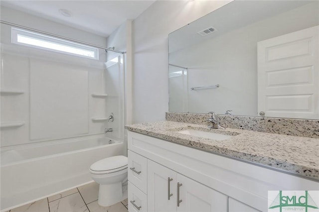 full bathroom featuring toilet, vanity, and bathtub / shower combination