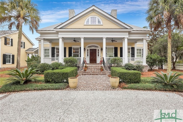 neoclassical / greek revival house with ceiling fan and a porch