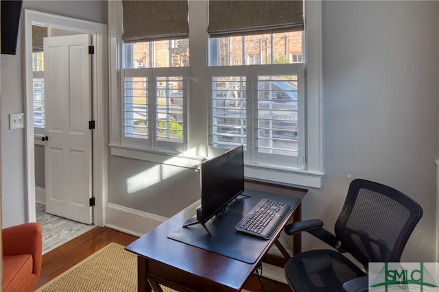 office with a healthy amount of sunlight and light wood-type flooring