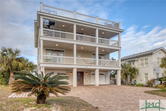 view of front facade with a balcony and a garage