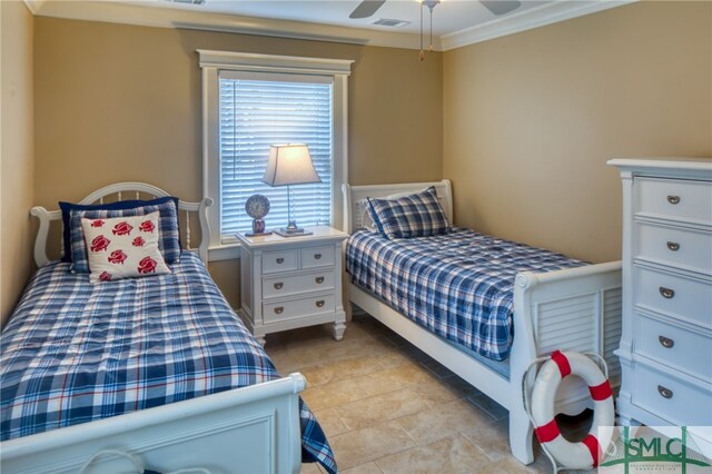 tiled bedroom featuring ornamental molding and ceiling fan