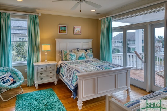 bedroom with light hardwood / wood-style floors, ornamental molding, ceiling fan, and access to outside