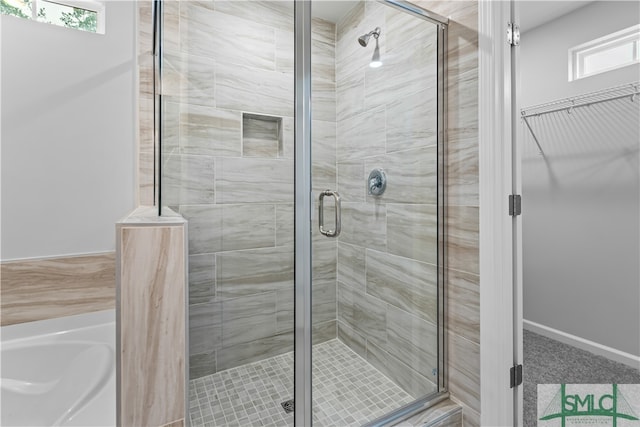 bathroom featuring an enclosed shower