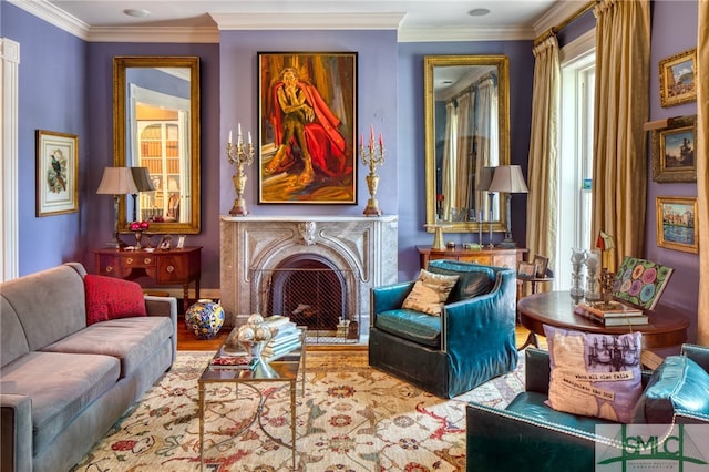 sitting room featuring crown molding and light wood-type flooring