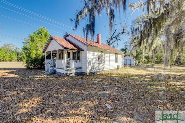 view of property exterior with a porch