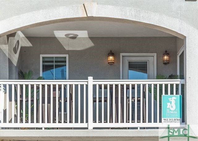 entrance to property featuring stucco siding