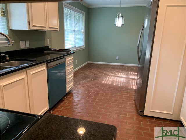 kitchen with hanging light fixtures, stainless steel dishwasher, white cabinetry, and ornamental molding