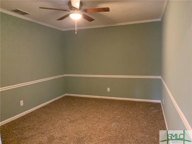 spare room featuring ceiling fan, a textured ceiling, ornamental molding, and carpet flooring