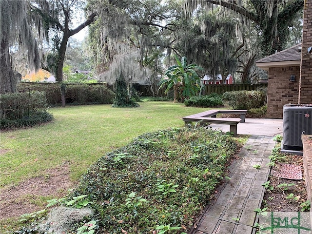 view of yard with central AC