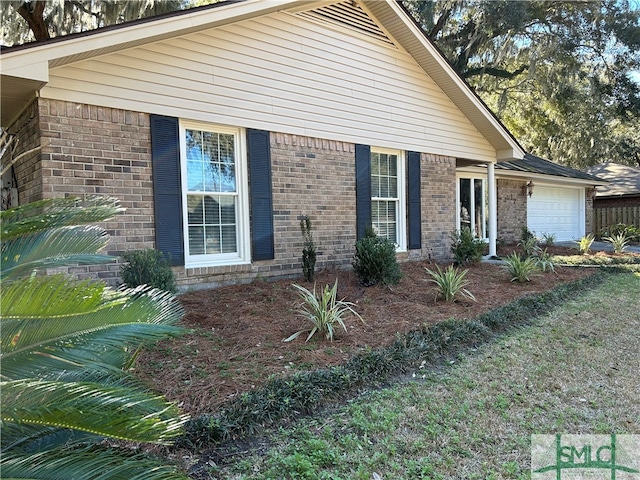 view of side of home with a garage