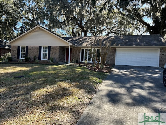 ranch-style home with a front yard and a garage