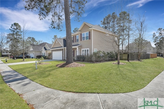 view of front of house featuring a front yard and a garage