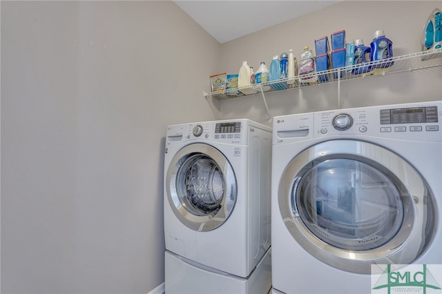 laundry room with independent washer and dryer