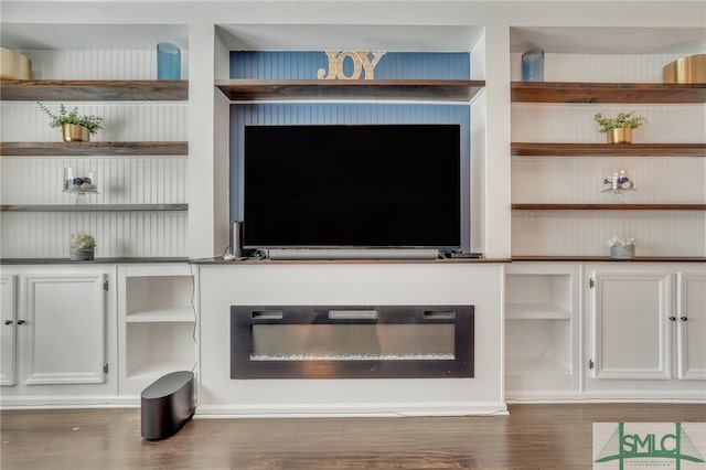 unfurnished living room with dark hardwood / wood-style flooring