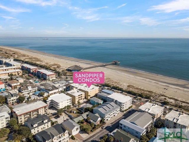 birds eye view of property featuring a water view and a view of the beach