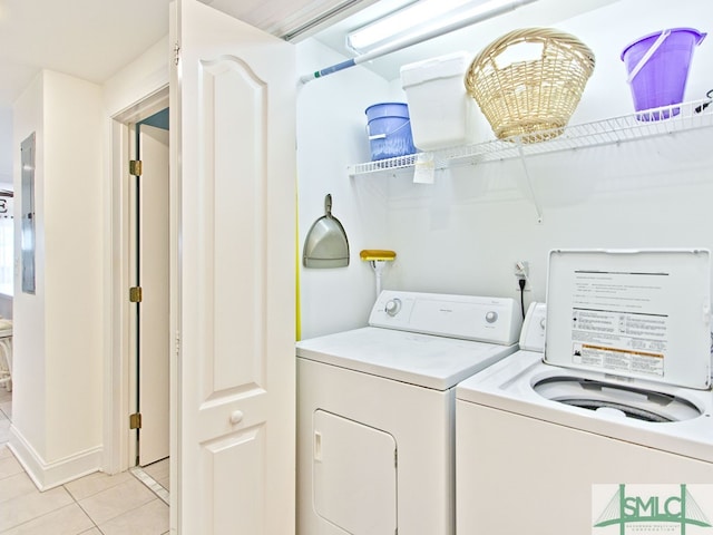 clothes washing area featuring independent washer and dryer and light tile floors
