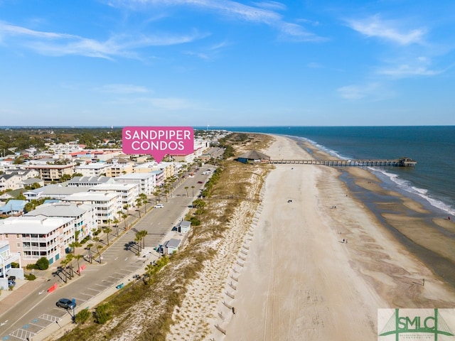 aerial view featuring a water view and a view of the beach