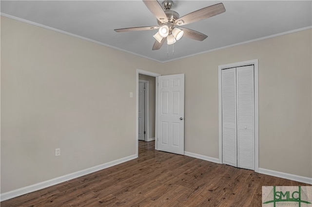 unfurnished bedroom featuring a closet, dark hardwood / wood-style floors, ceiling fan, and ornamental molding