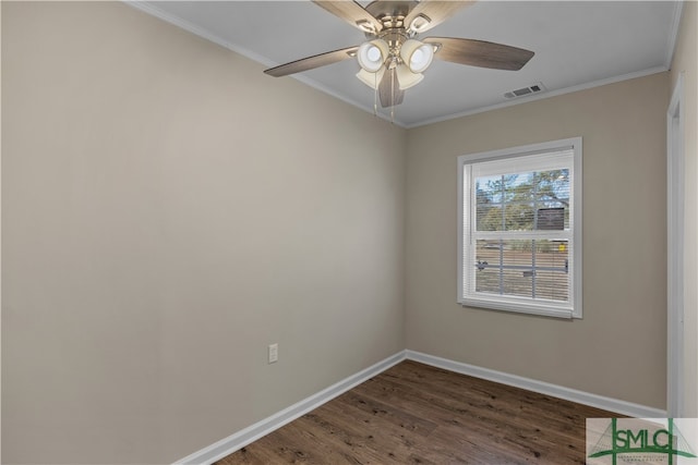 empty room featuring ceiling fan, crown molding, and dark hardwood / wood-style floors