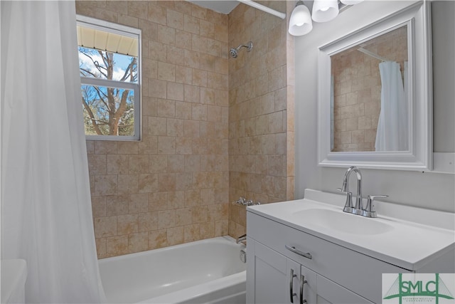 bathroom featuring vanity and shower / bath combination with curtain