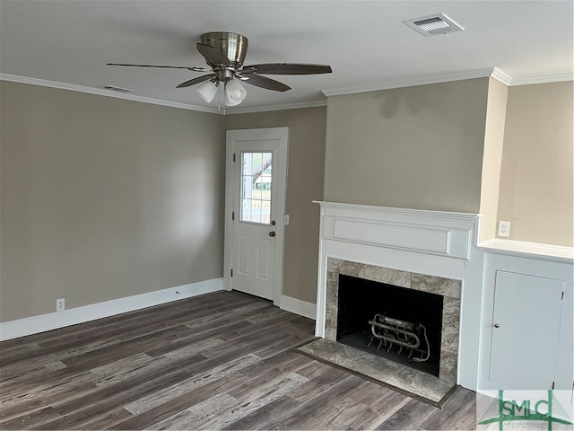 unfurnished living room with dark hardwood / wood-style floors, ceiling fan, a fireplace, and ornamental molding