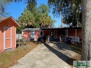 view of front of home with a storage unit