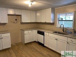 kitchen with white cabinetry, sink, light hardwood / wood-style flooring, light stone counters, and dishwasher