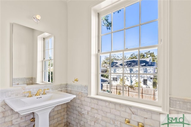 bathroom with tile walls