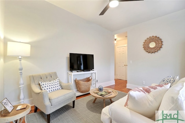 living room featuring ceiling fan and light wood-type flooring