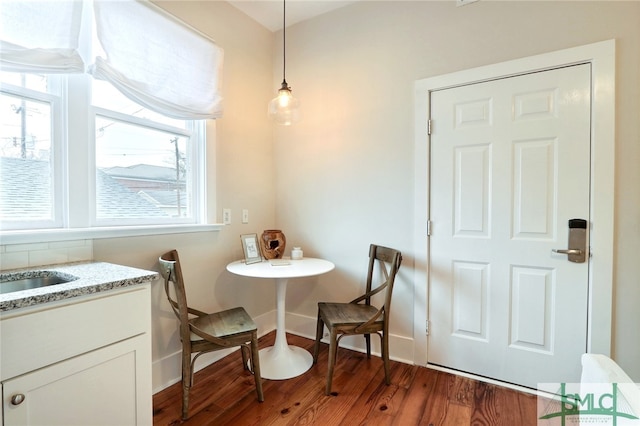 dining area featuring dark hardwood / wood-style flooring