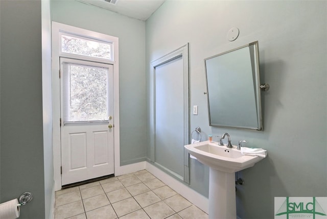 bathroom with tile flooring