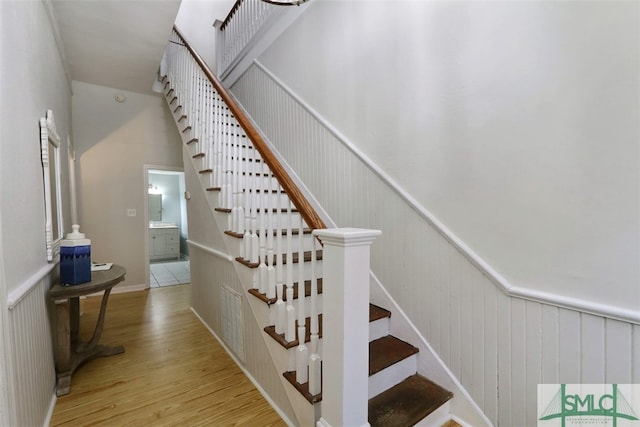 stairs featuring light hardwood / wood-style flooring