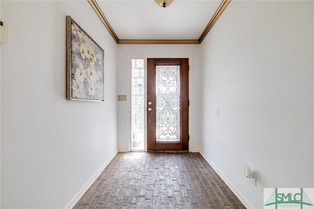 entryway with crown molding and a wealth of natural light