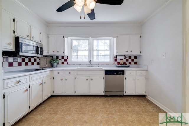 kitchen featuring ceiling fan, light tile floors, white cabinets, stainless steel appliances, and tasteful backsplash