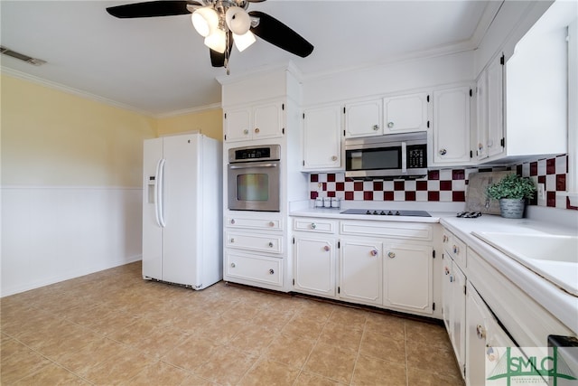 kitchen featuring backsplash, ceiling fan, appliances with stainless steel finishes, light tile floors, and white cabinets