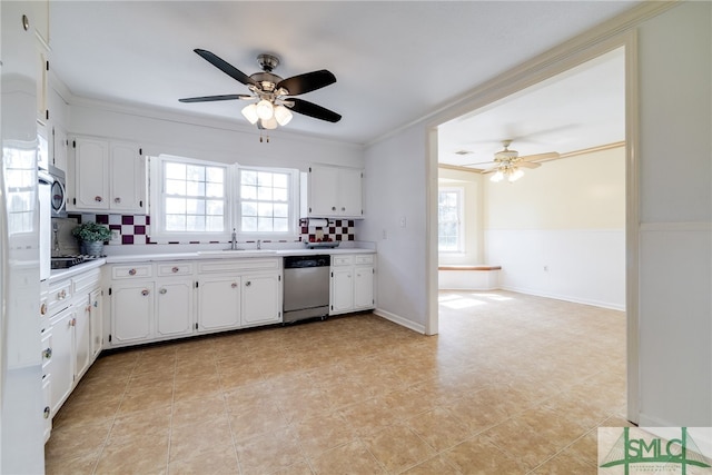 kitchen featuring white cabinets, tasteful backsplash, stainless steel appliances, and ceiling fan