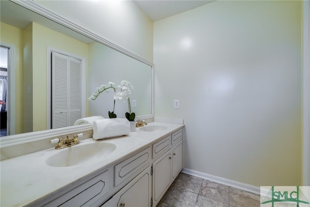 bathroom featuring tile flooring and dual bowl vanity