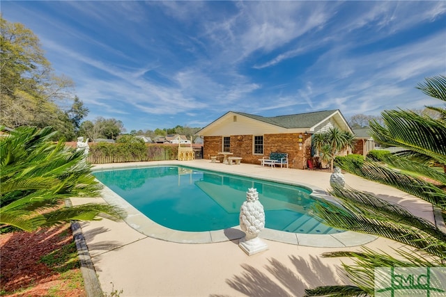 view of pool featuring a patio