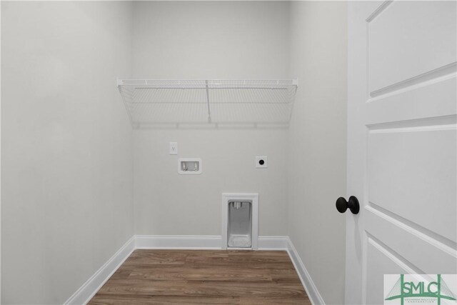 clothes washing area with hardwood / wood-style floors, hookup for a washing machine, and hookup for an electric dryer