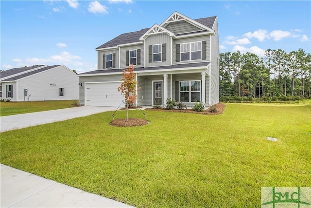 craftsman inspired home featuring an attached garage, board and batten siding, a front lawn, and concrete driveway