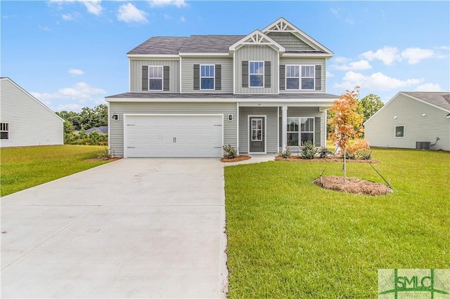 craftsman inspired home with an attached garage, board and batten siding, a front yard, central AC, and driveway