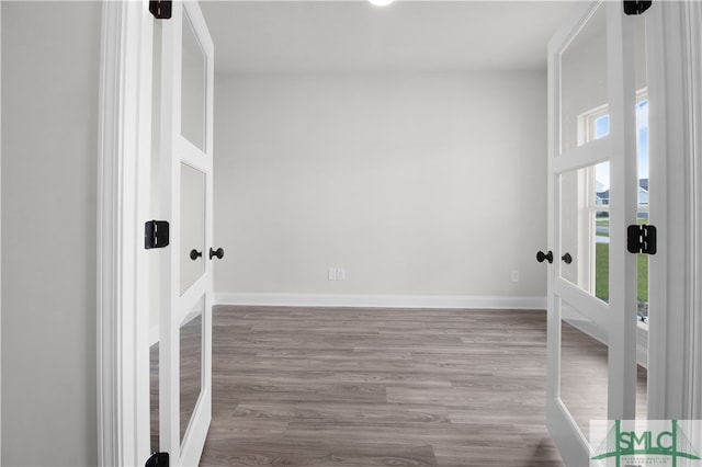 spare room with hardwood / wood-style flooring