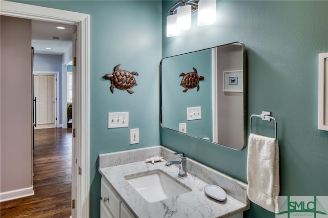 bathroom featuring hardwood / wood-style floors and vanity